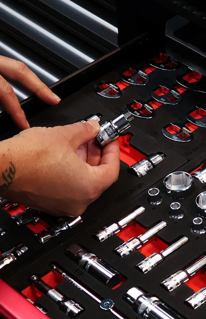 Technician placing a BoxoUSA 1/2 inch drive Torx bit socket into EVA foam in a tool box drawer
